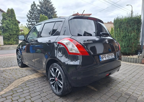 Suzuki Swift cena 34700 przebieg: 100200, rok produkcji 2015 z Żychlin małe 326